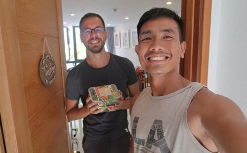 A customer receiving his macro meal in Da Nang with Fuel Meals